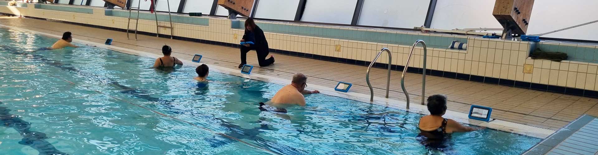 People poolside using iPads in Good Boost session