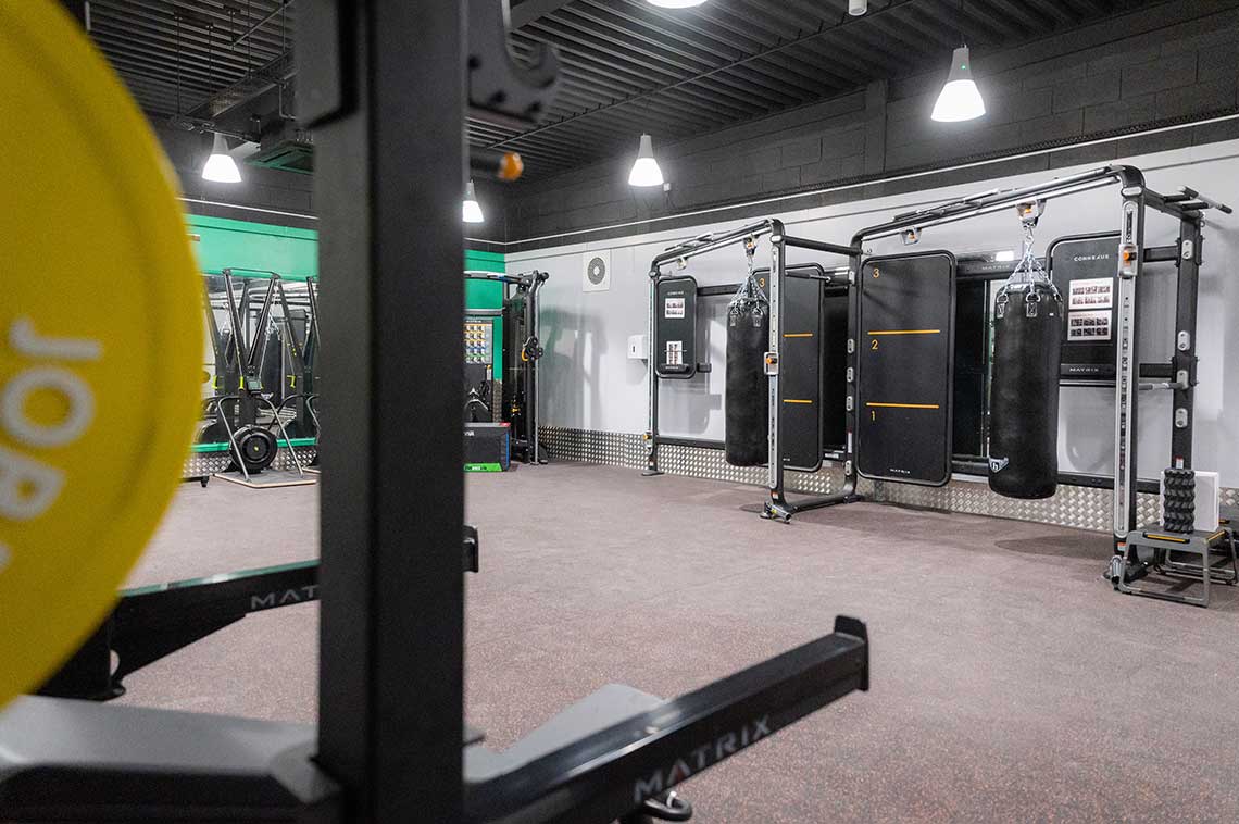 Gym area with punch bags and skiergs